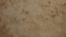 Macro view of a custom concrete countertop texture showing the unique artisanal movement and matte finish of a Noble Elegance overlay.